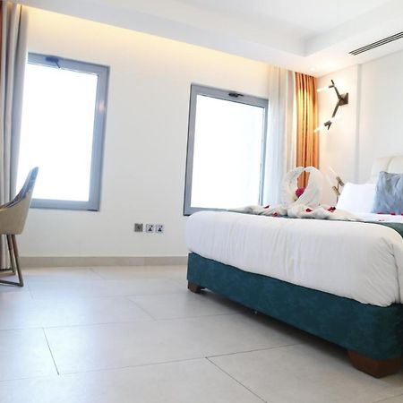 Waterfront Hotel Apartment Lusail Exterior photo A room at the hotel